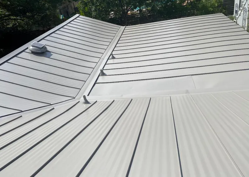 Solar attic fan installed on a metal roof for Roof Ventilation in Turpin Hills